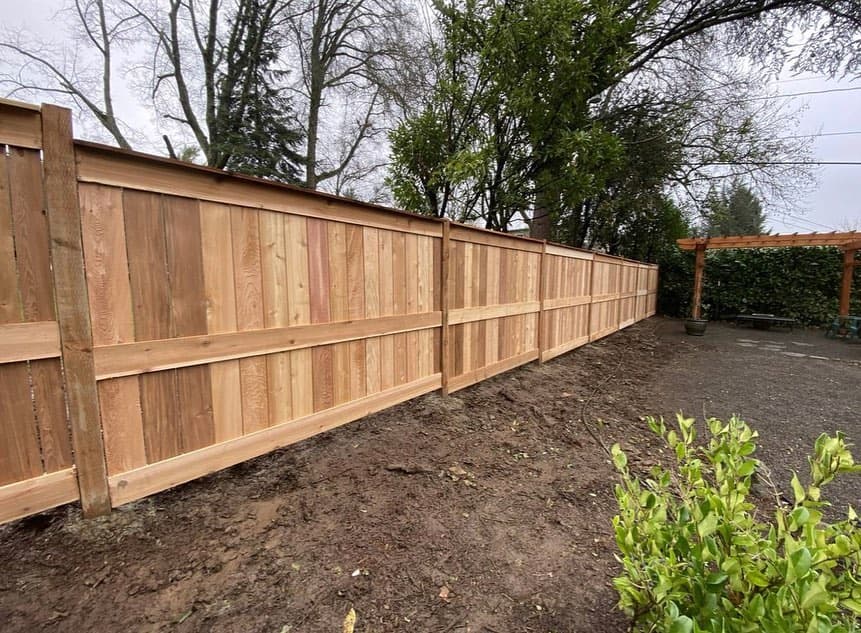 Freshly installed cedar privacy fence by GI Landscape